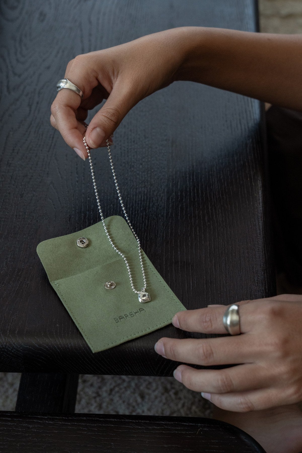 Checking a necklace before packing