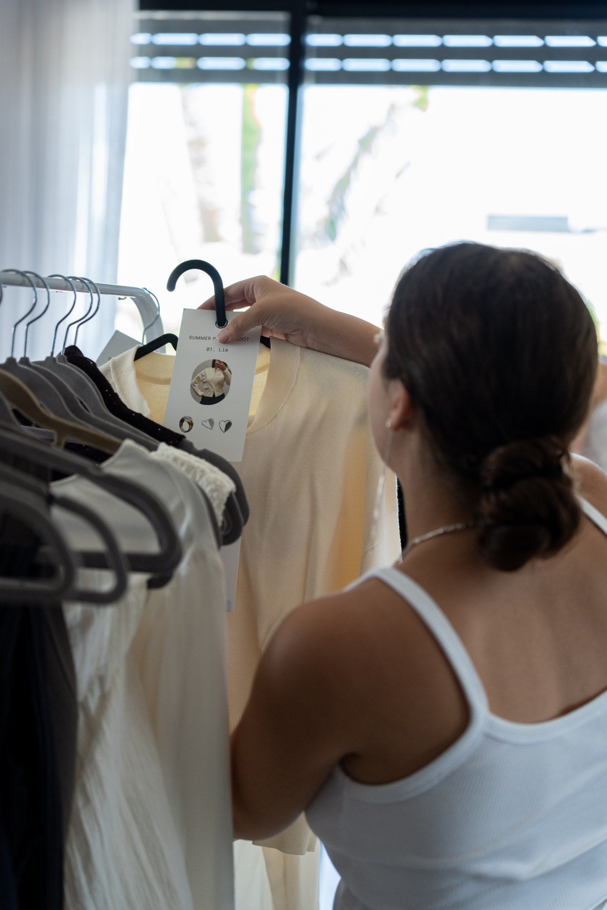Selecting a necklace and clothing for a photoshoot